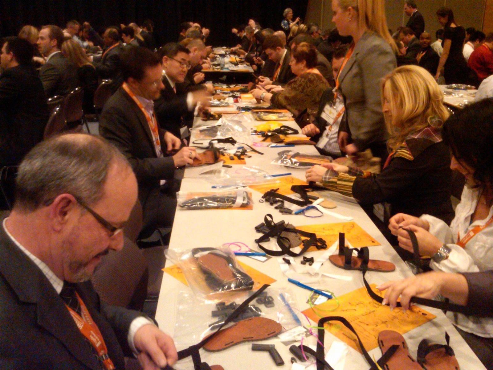 Corporate group building sandals at a conference